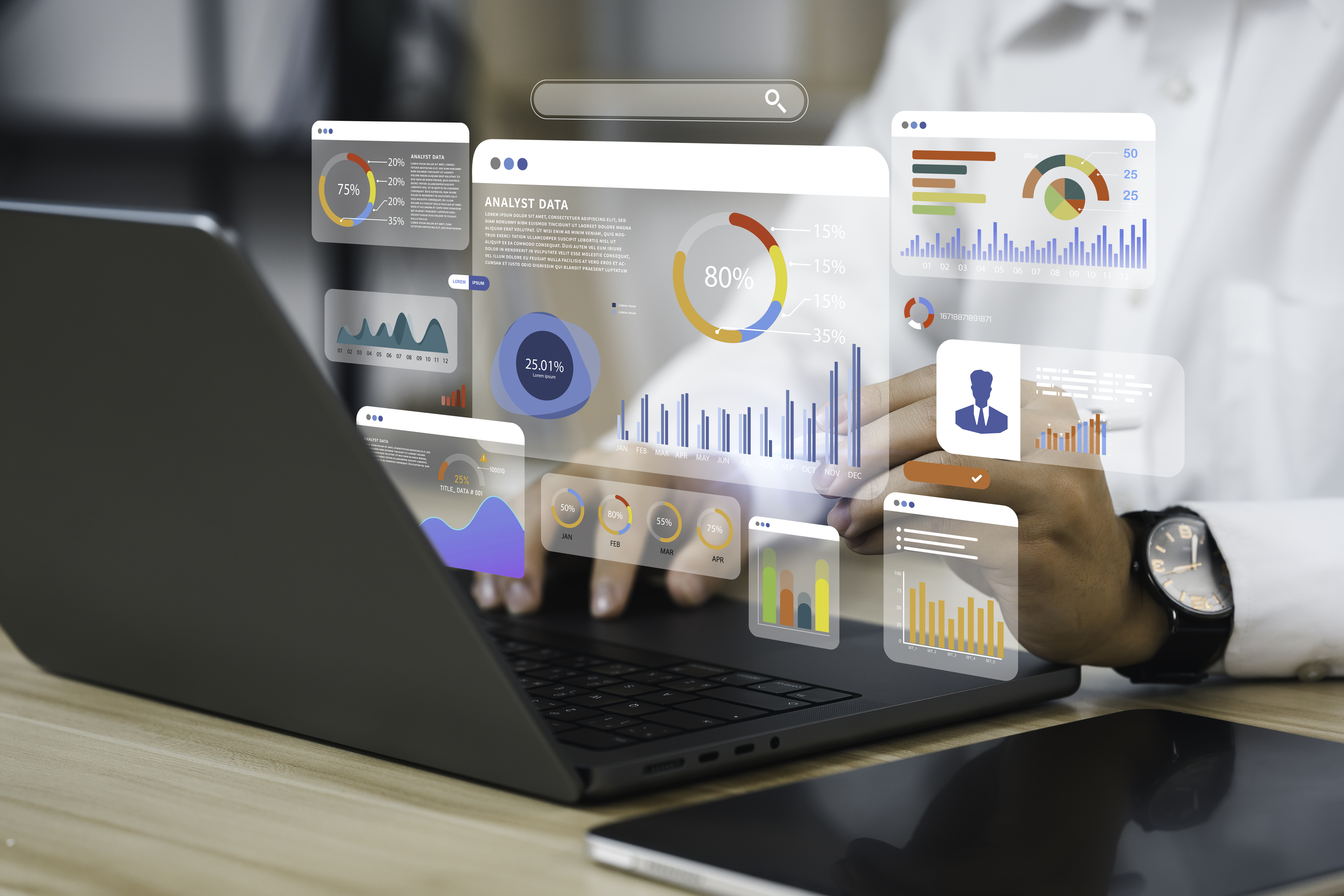 A person looking at charts on a laptop.