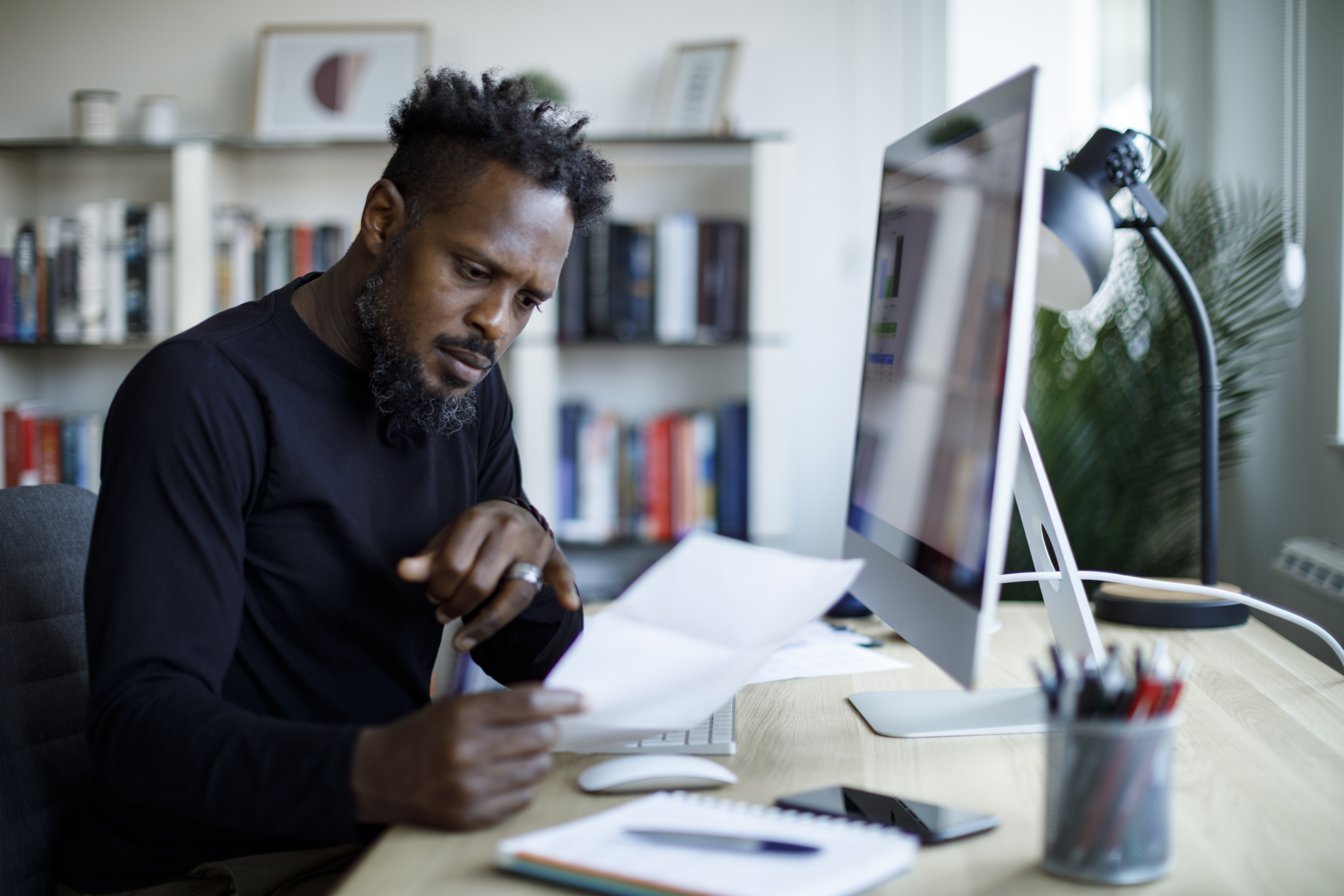 Investor working at a desk.