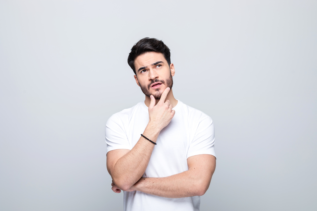 Person in a thinking pose and looking perplexed.