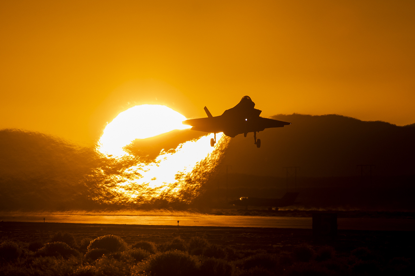 F-35 taking off in front of a sunset. IS LMT