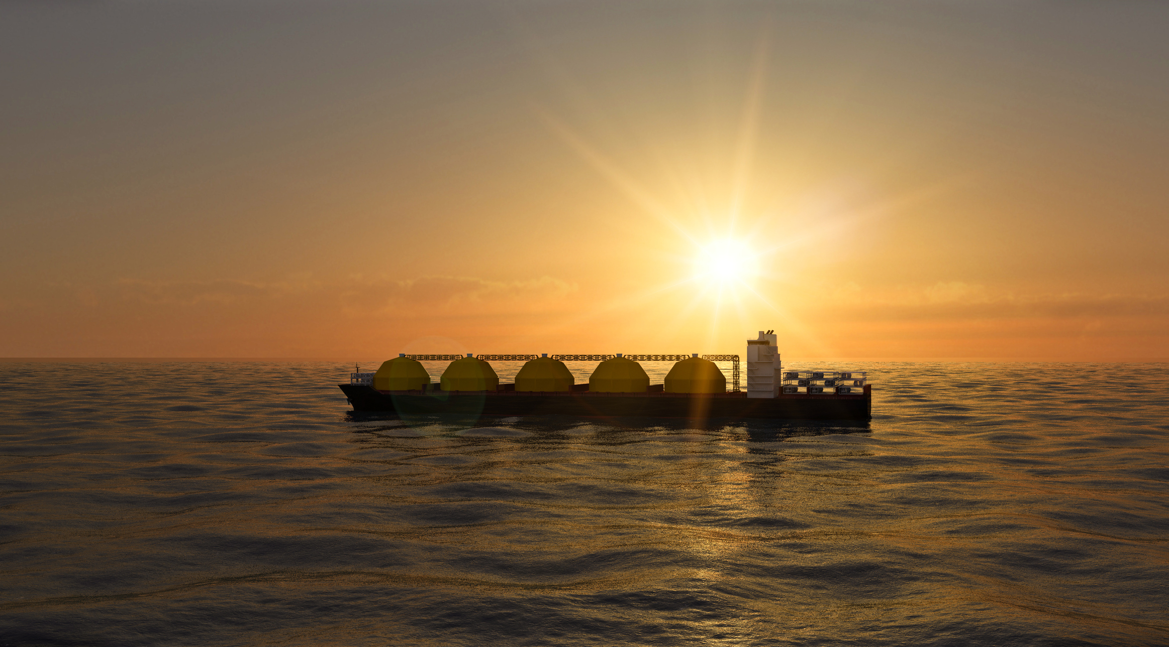An LNG tanker at sea at sundown or sunrise
