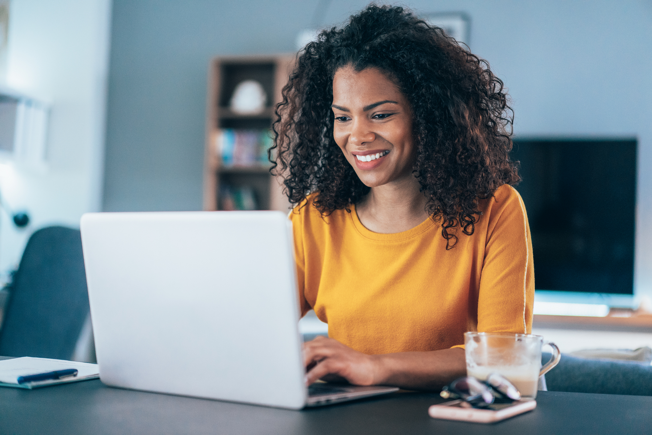 Smiling person using computer