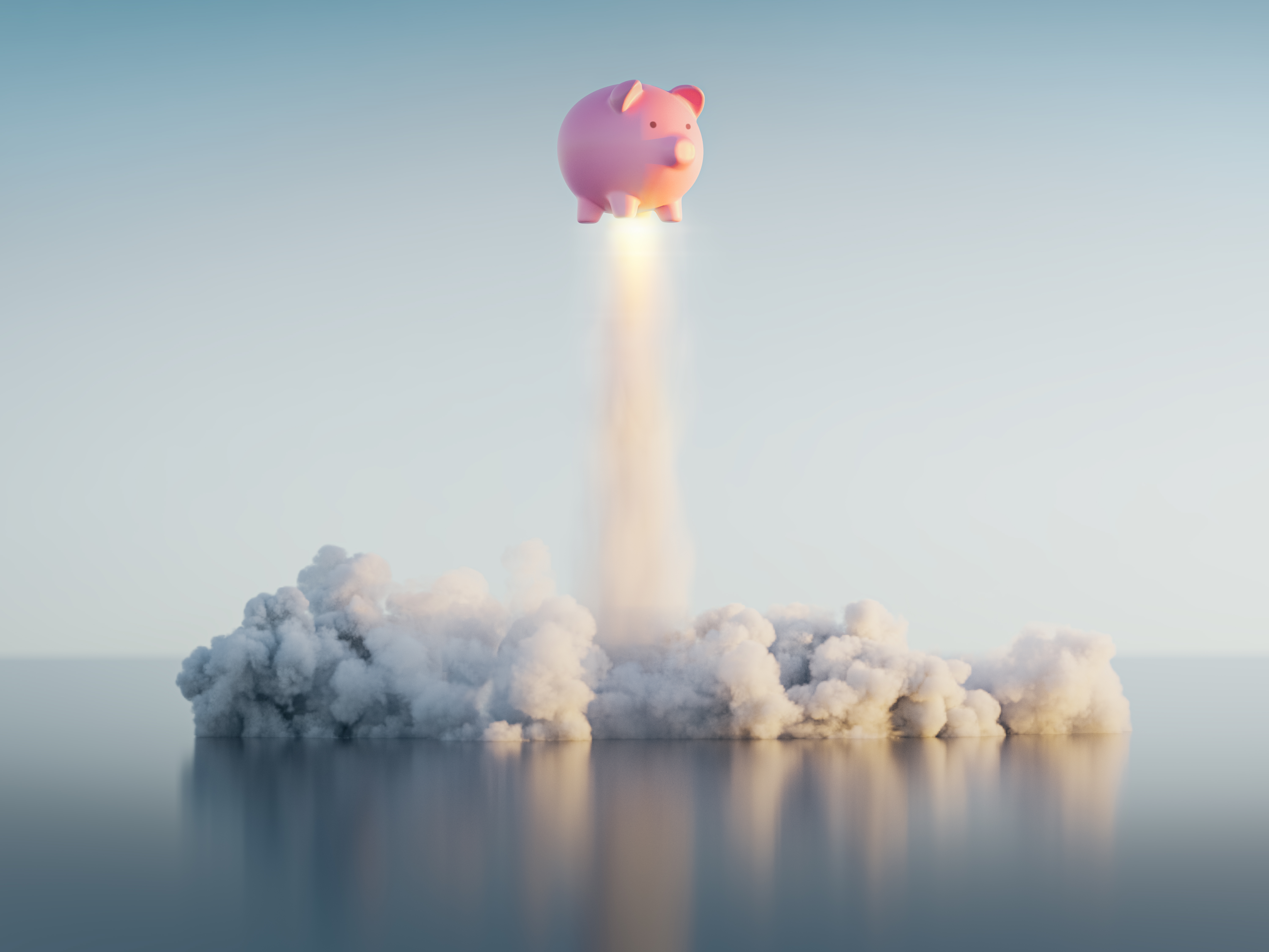 A piggybank blasting off like a rocket ship.