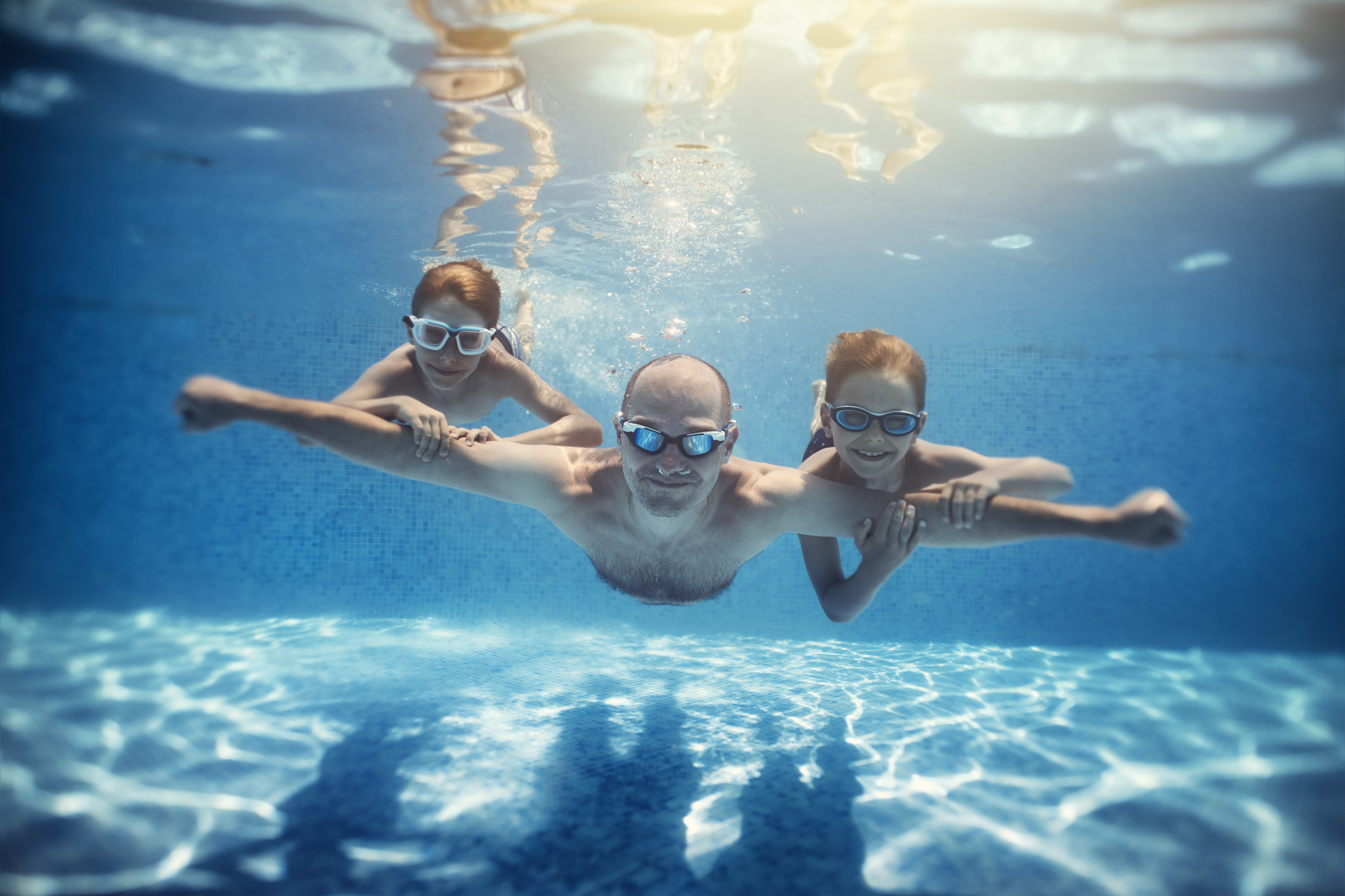 Family swimming underwater