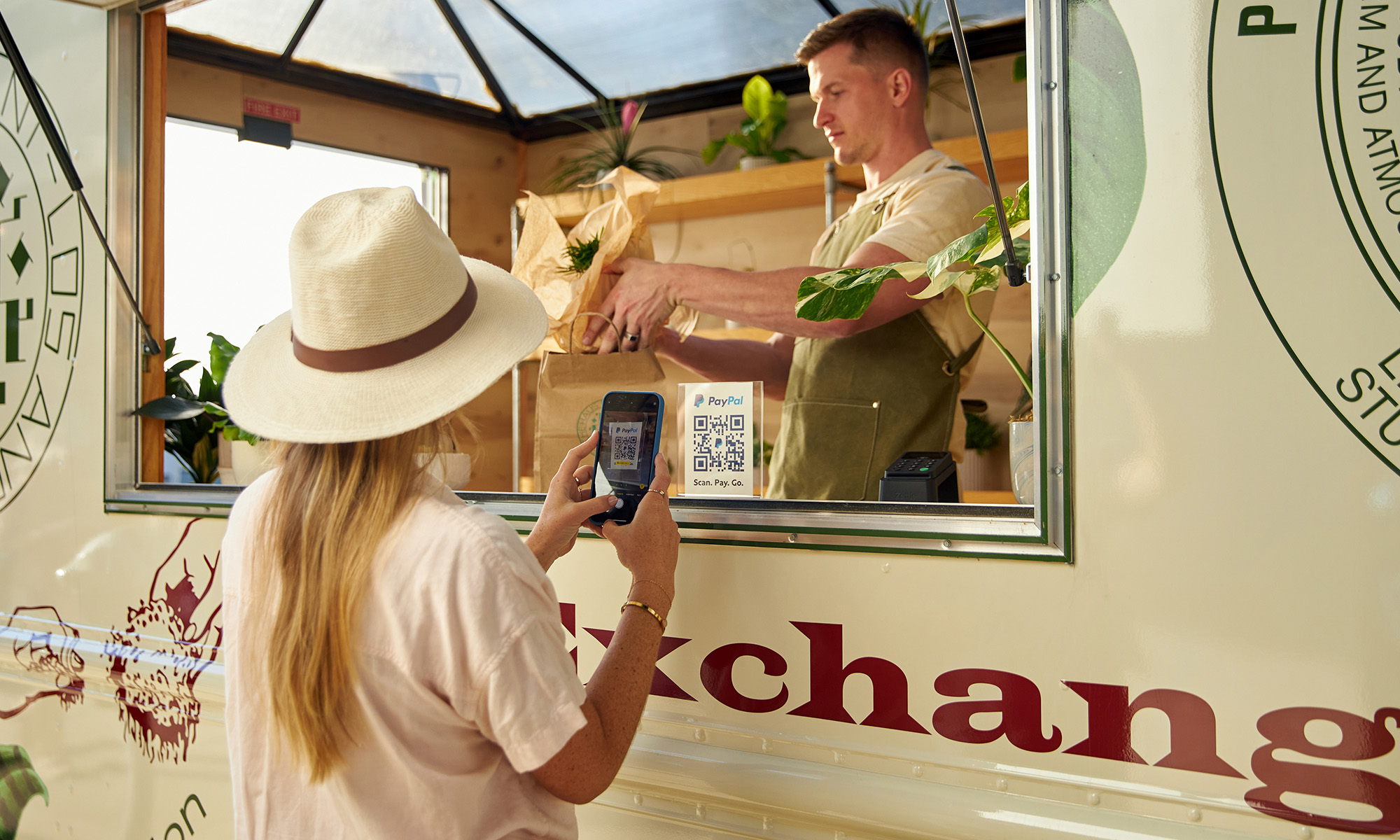 Person buying food with PayPal QR code_PayPal