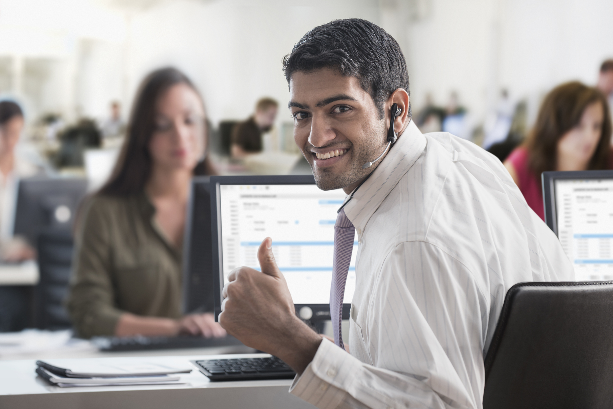 Business person giving thumbs up