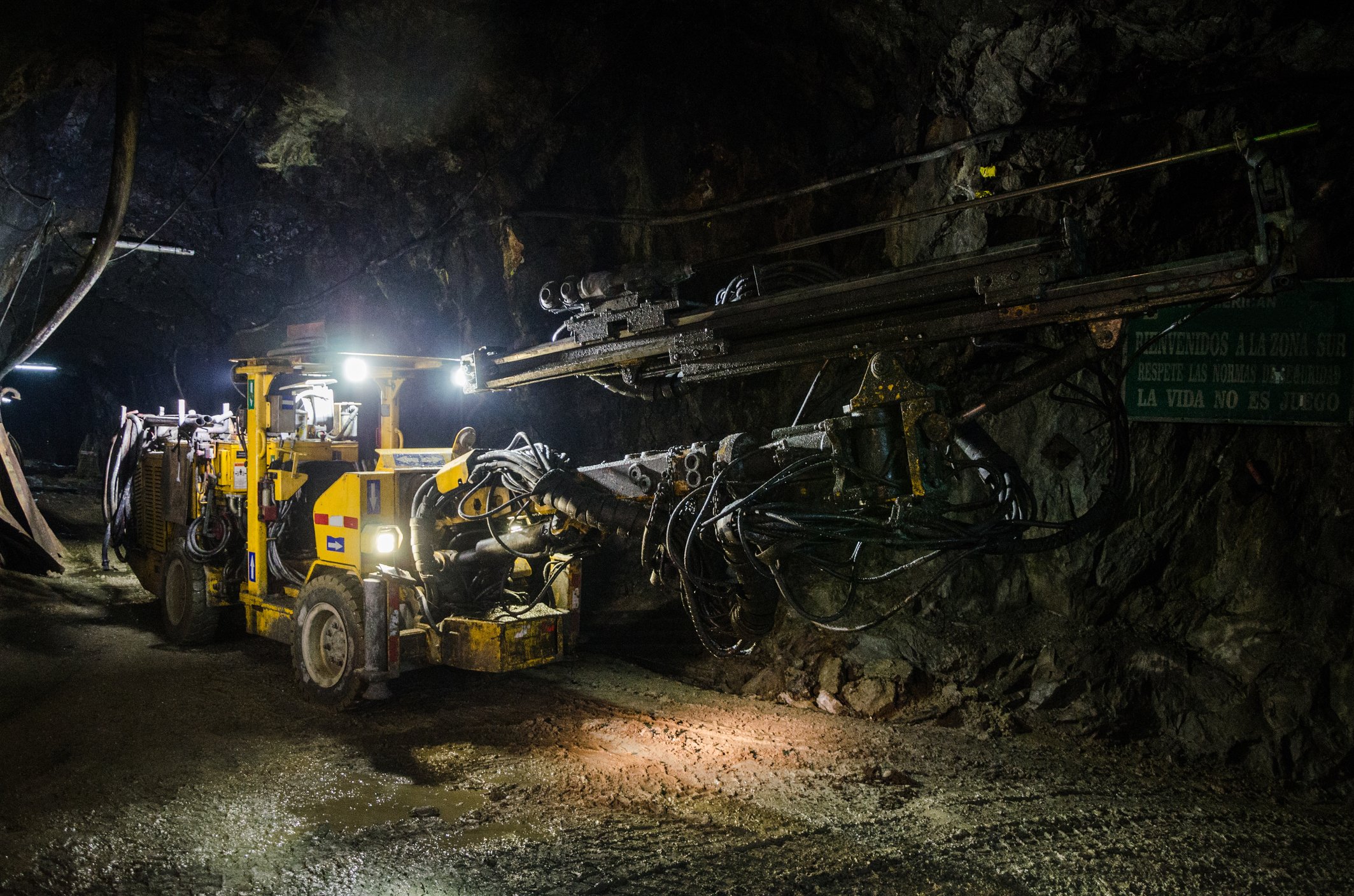 Heavy mining machinery underground.