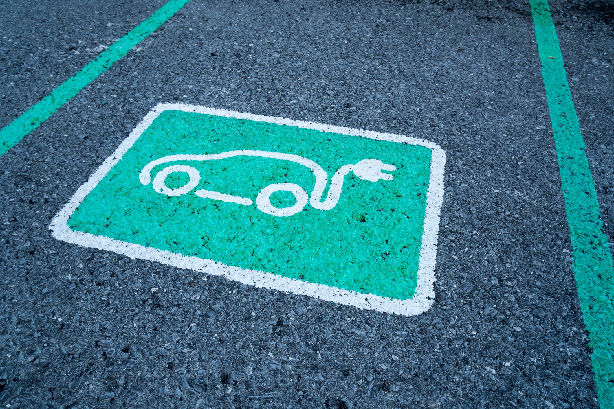 Electric car logo on parking space