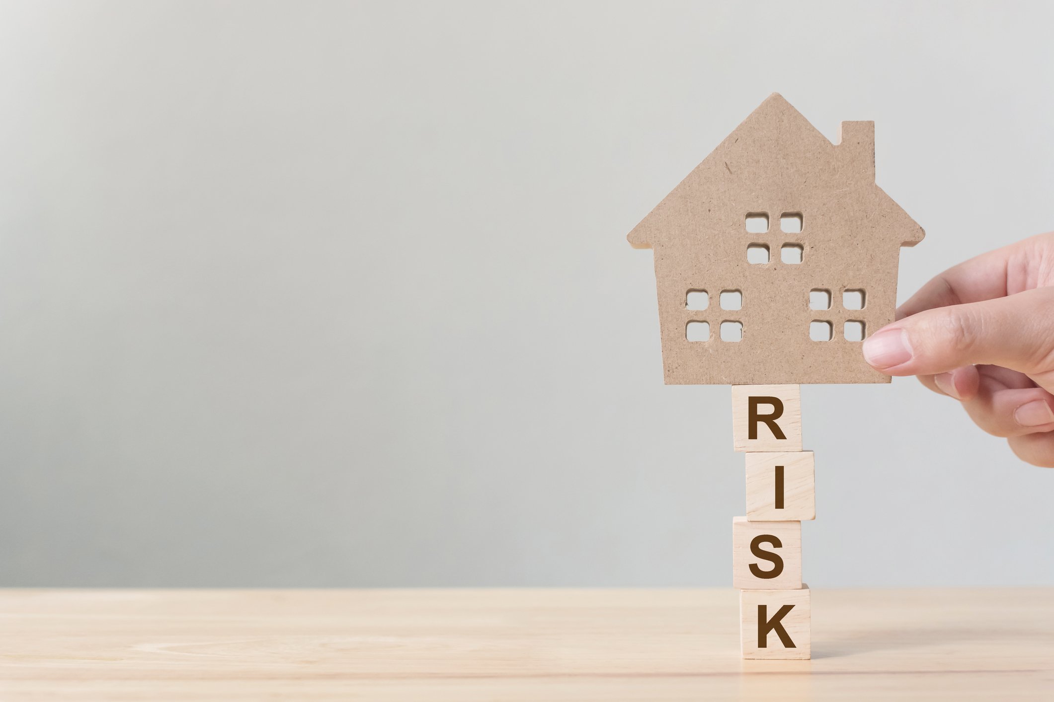 House balanced on risk