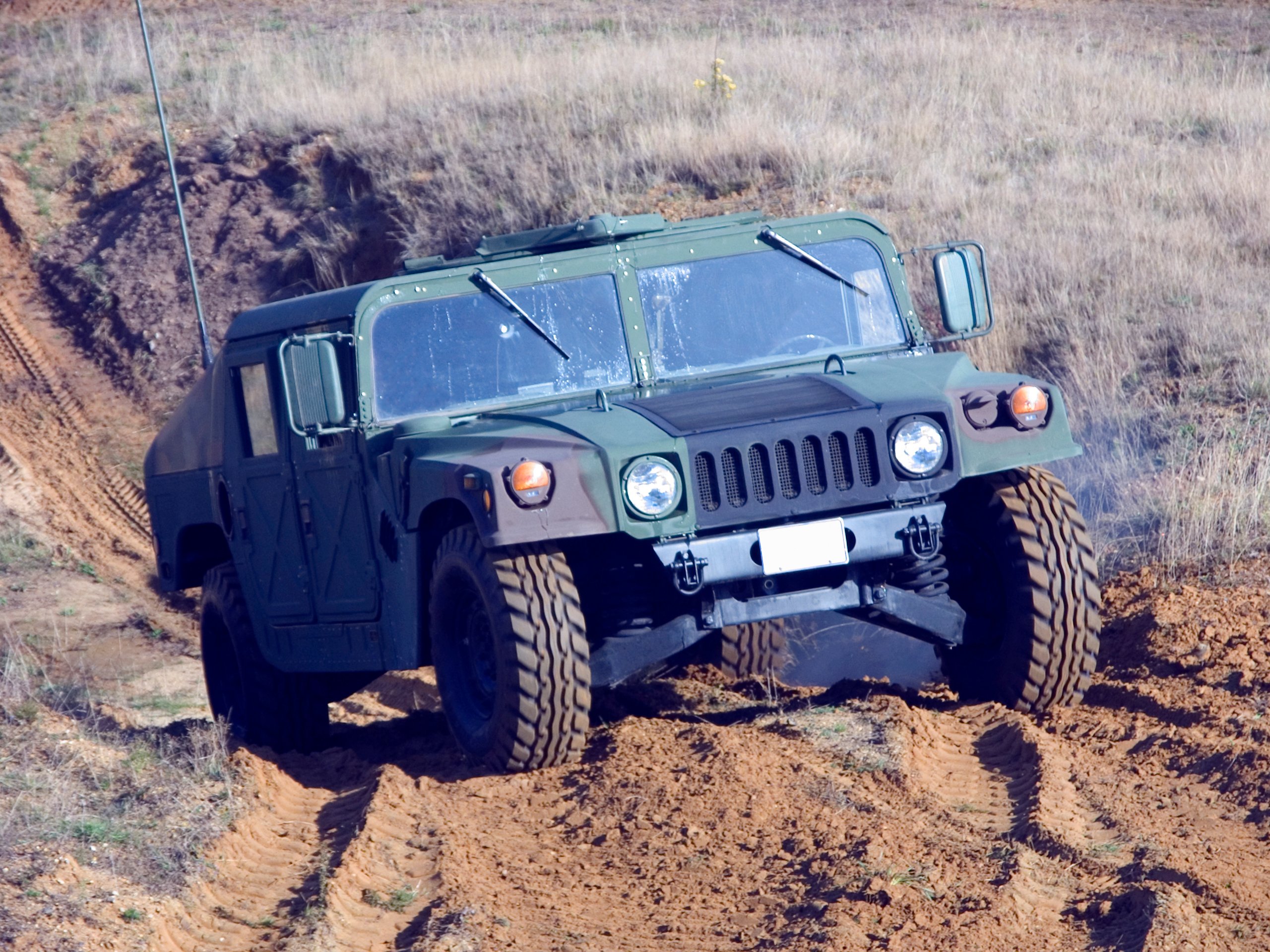 A military Humvee driving off road.