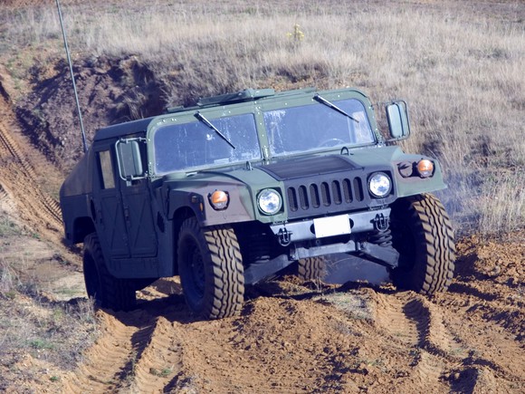 A military Humvee driving off road.