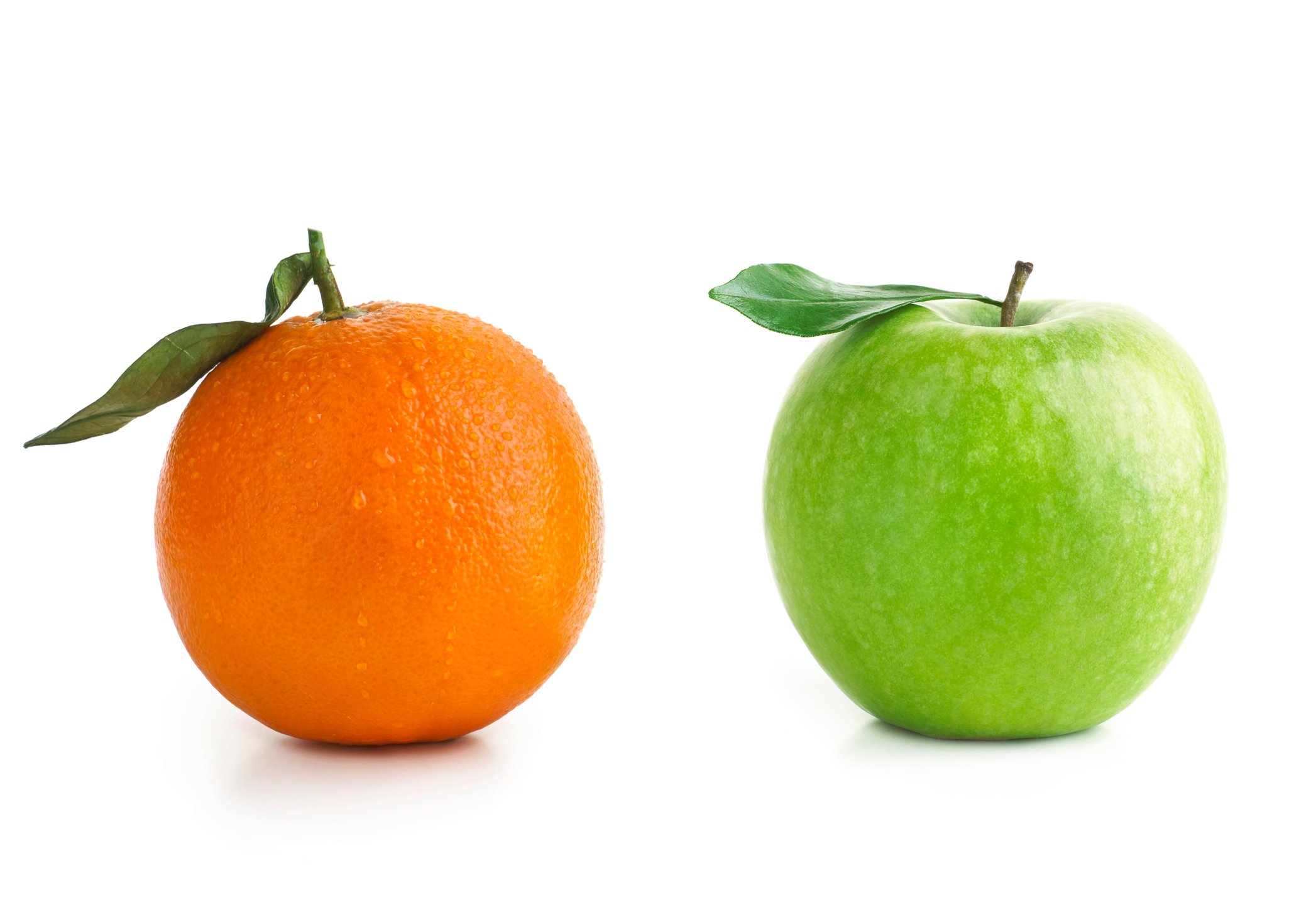 An orange and a green apple compared side by side.