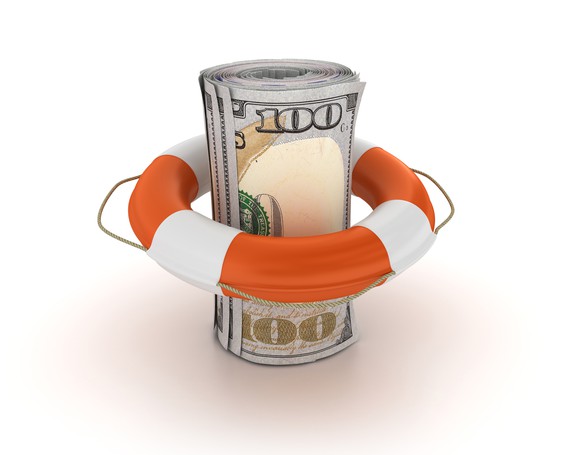 A roll of hundred-dollar bills encircled by a life preserver.