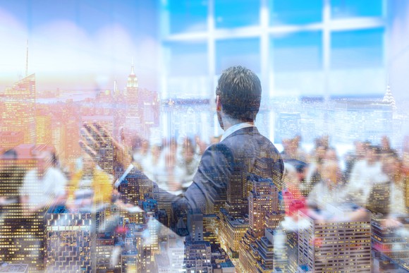 A man presenting in front of a group of people.