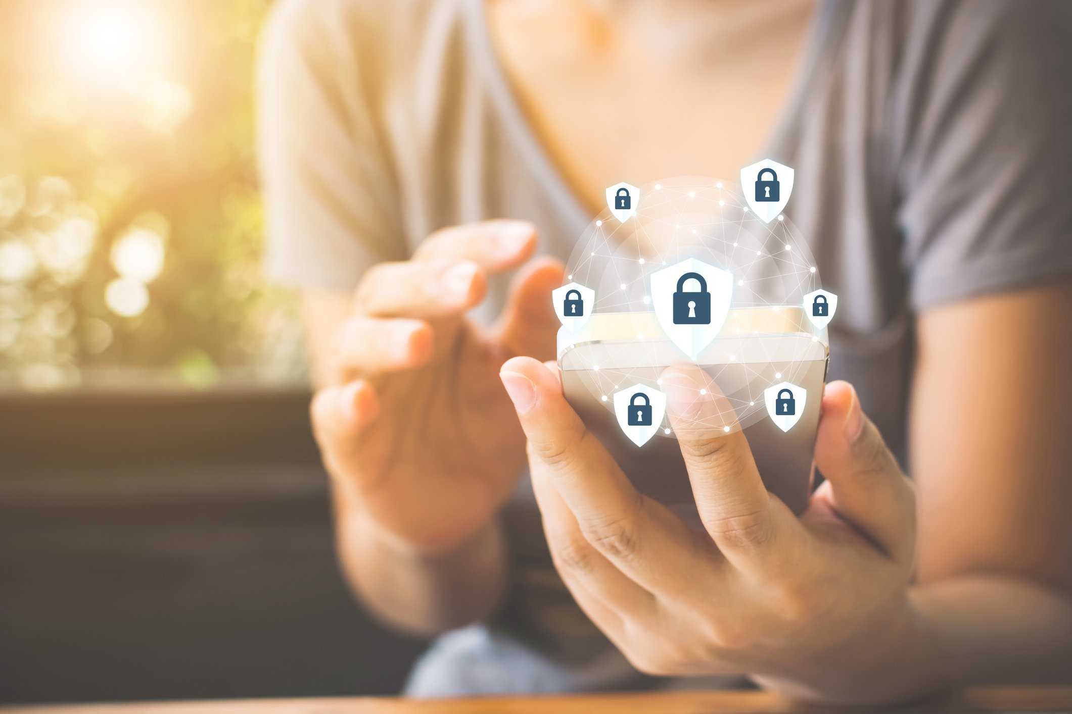 Identity theft protection icons surround a mobile phone.