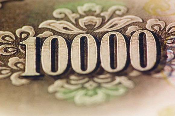 Close-up of the number 10,000 on a $10,000 bill.