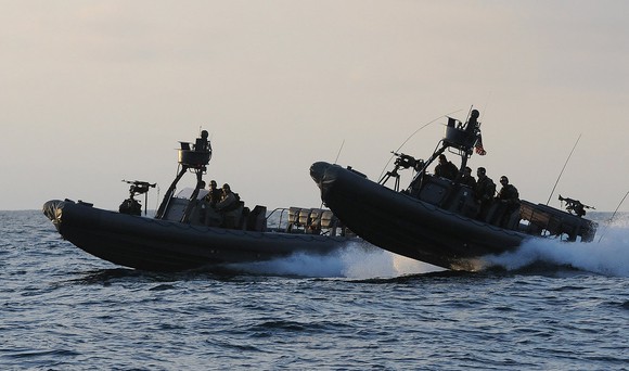 Two Navy boats on open water.