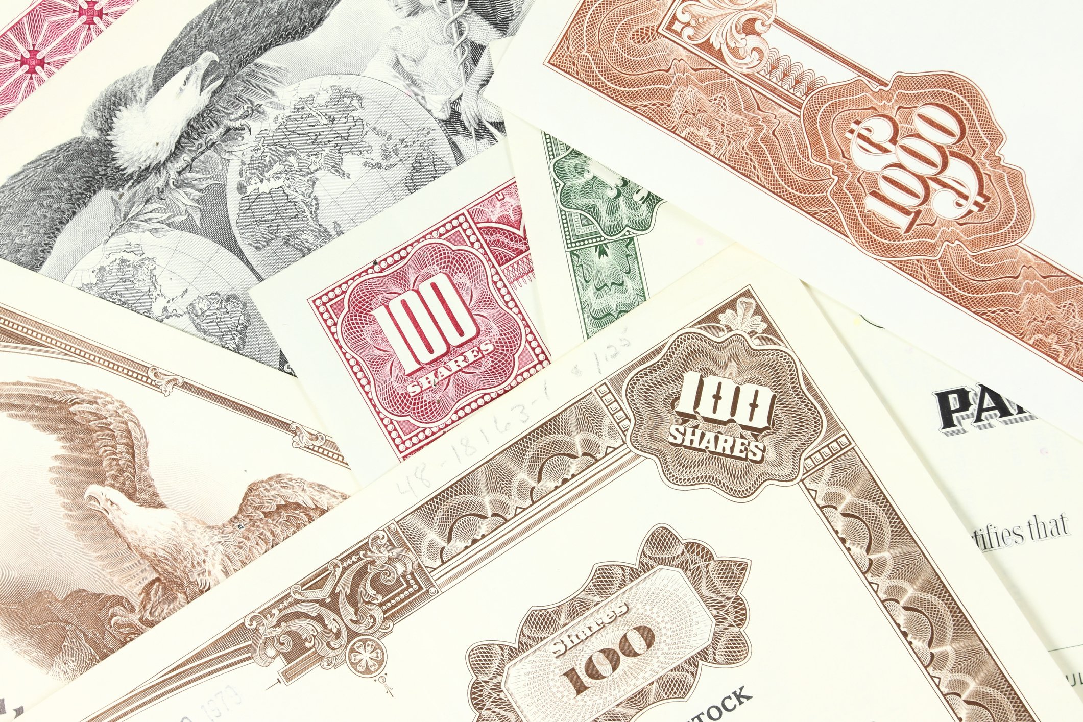 A pile of stock certificates