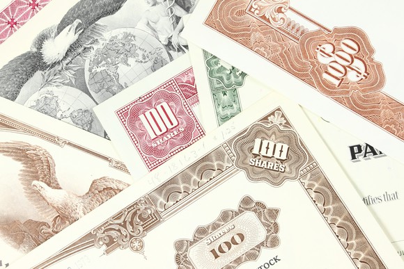 A pile of stock certificates