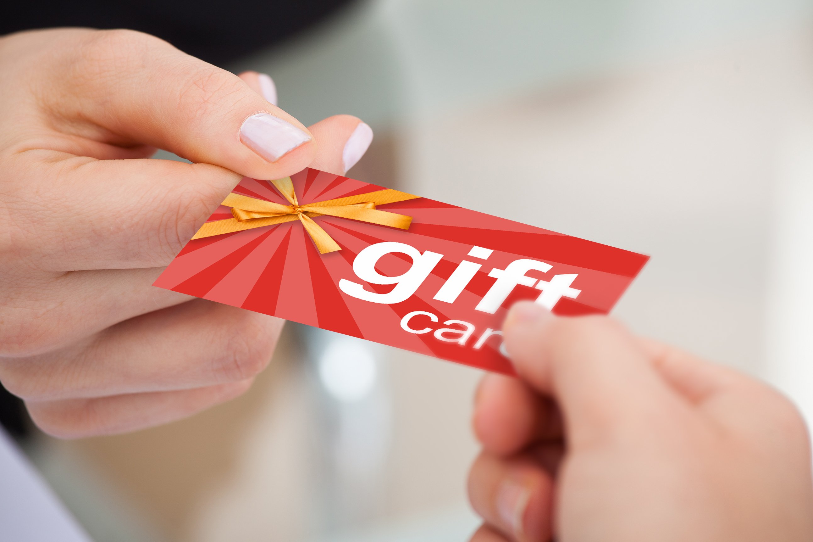 Handing over a gift card