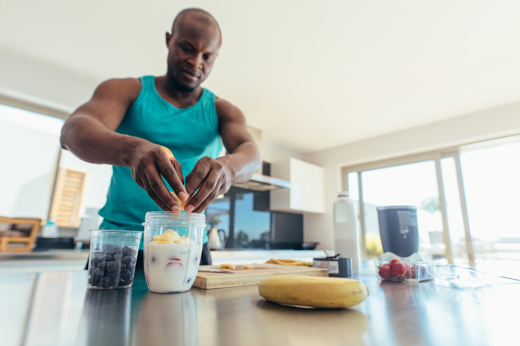 Making making a smoothie with blueberries and bananas