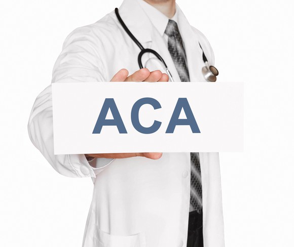 Doctor with ACA sign
