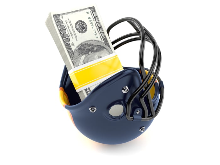 Football helmet with money