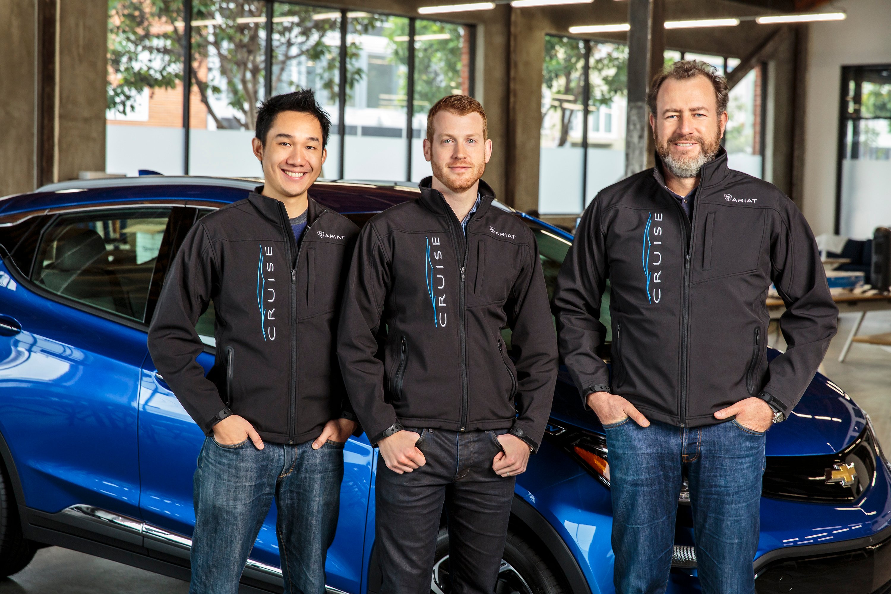 Daniel Kan and Kyle Vogt with GM president Dan Ammann