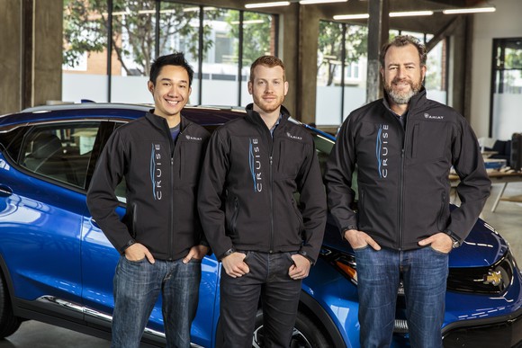 Daniel Kan and Kyle Vogt with GM president Dan Ammann
