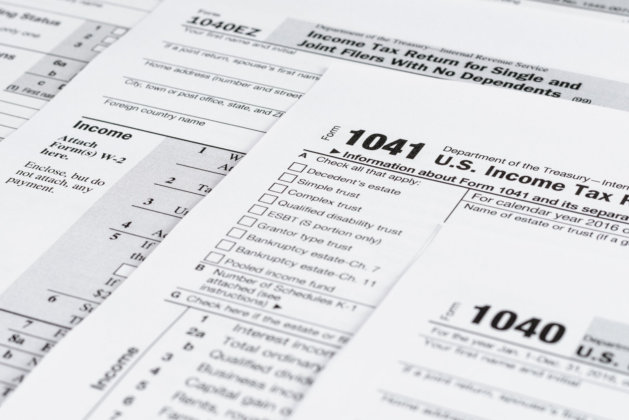Various tax forms partially covering each other