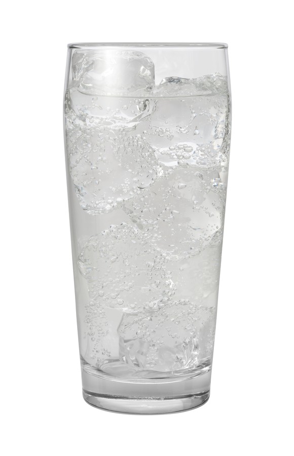 A glass of sparkling water on ice.