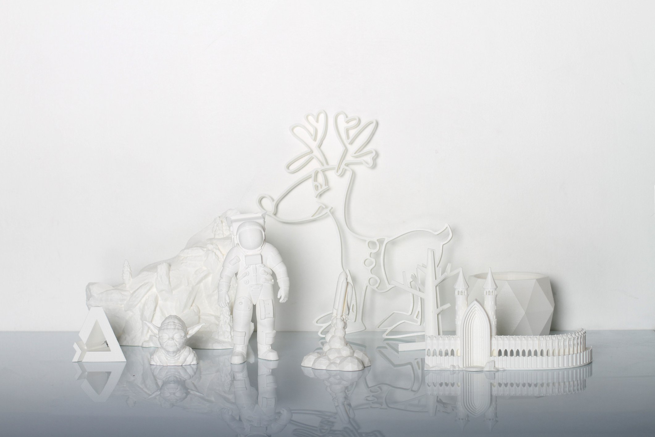 A collection of 3D-printed objects in white plastic