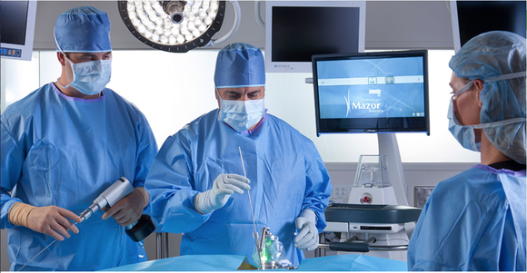 Neurosurgeon using one of Mazor's robotic surgery systems.