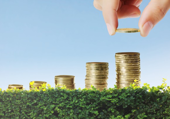 A growing stack of coins, representing long-term investment growth. 