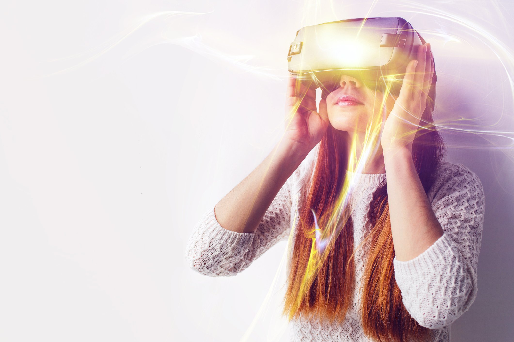 Young woman wearing a virtual reality headset.