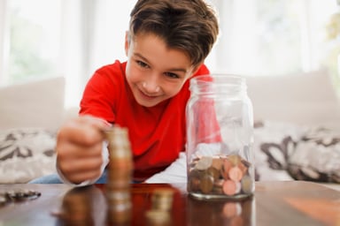 boy stacking coins_GettyImages-108359493