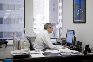 man working at desk_GettyImages-83121902