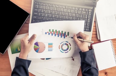 Getty-Images-Businesswoman-Analyzing-Reports