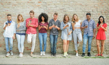 Group_of_young_people_using_smartphones
