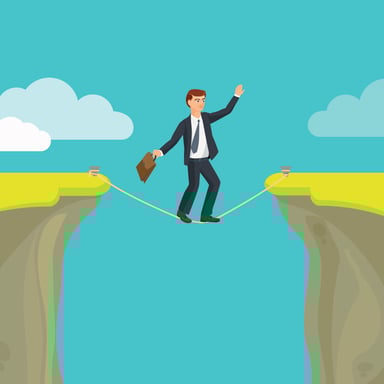 business man walking tight rope cliff