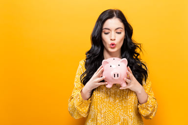 woman_holding_piggy_bank