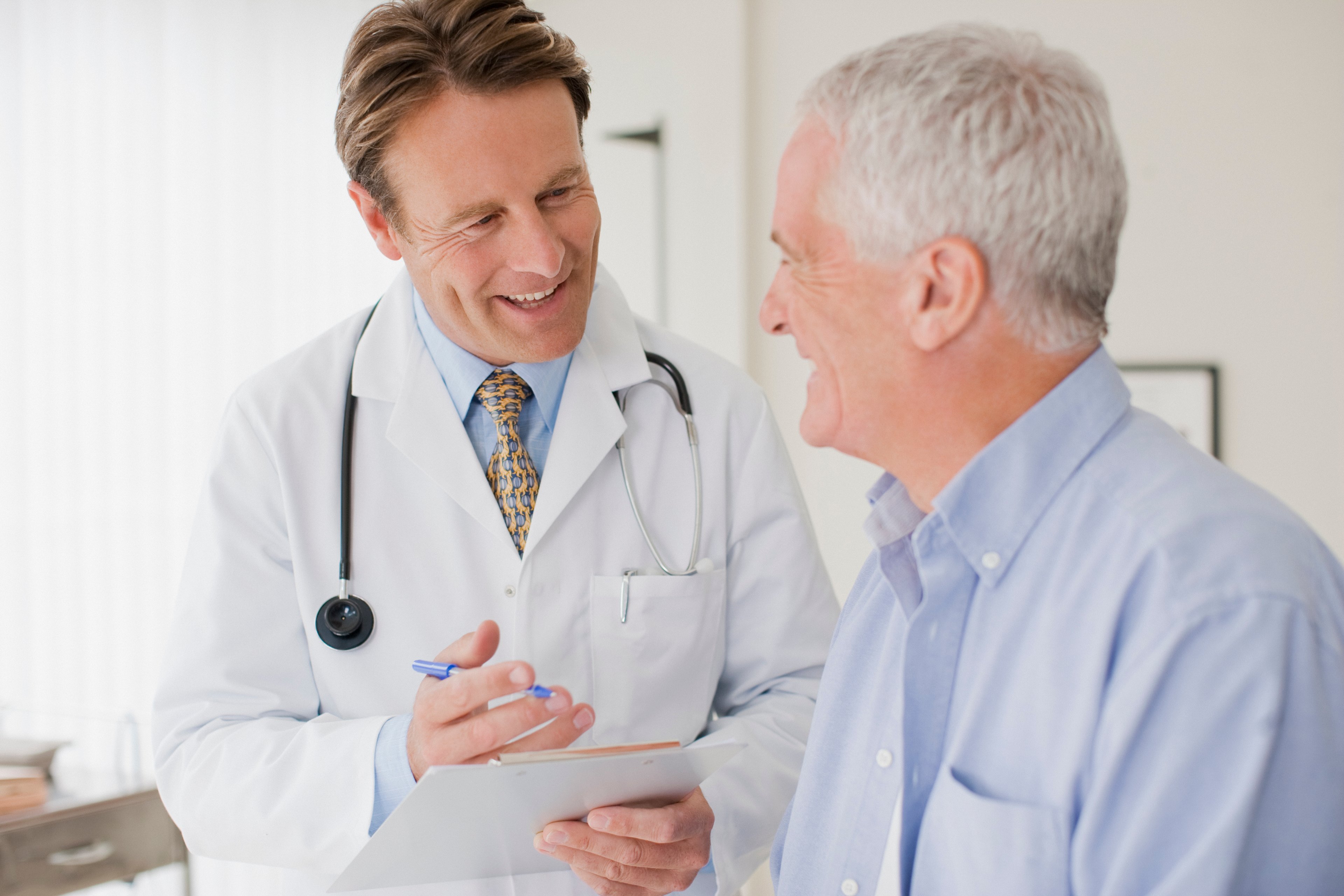 Doctor with Elderly Patient Medicare Getty