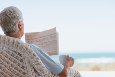 man reading newspaper_GettyImages-116379055