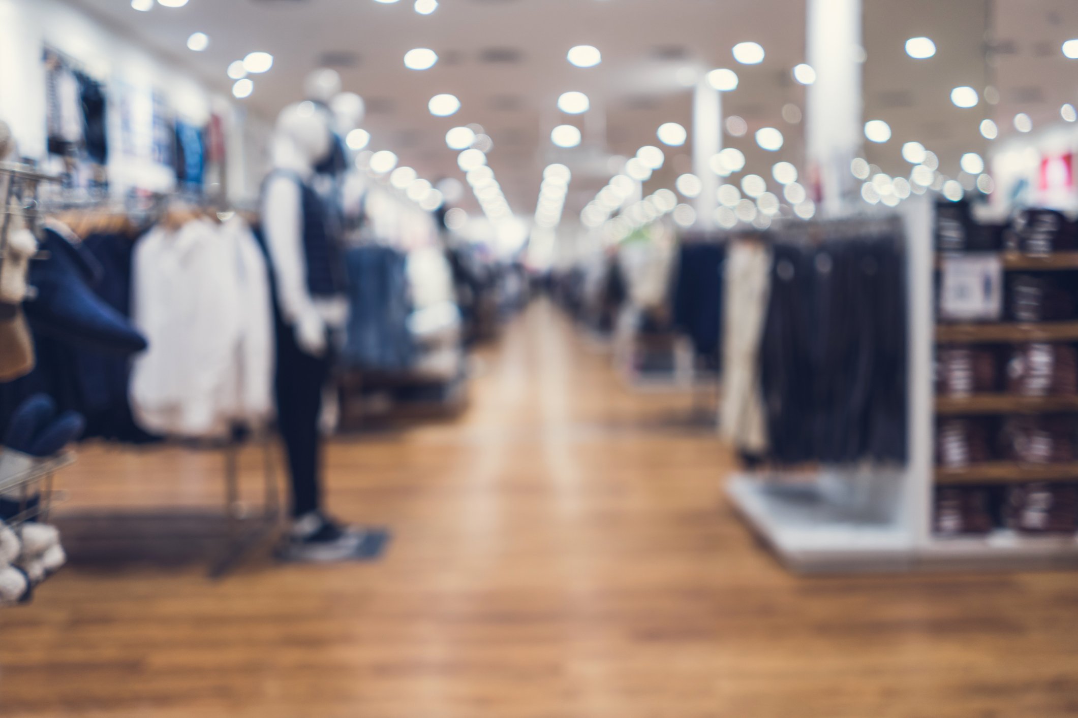 A blurred image of the inside of a department store