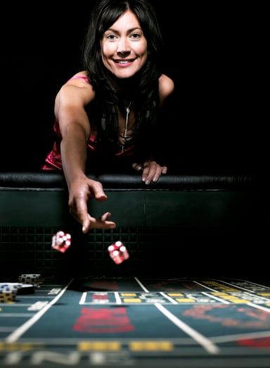 dice craps gambling woman rolling casino getty