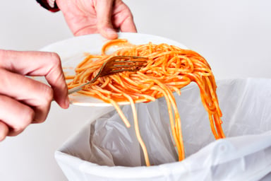 throwing out leftover food_GettyImages-505342986