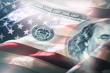 Hundred_dollar_bill_over_American_flag