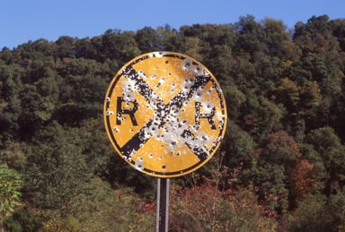 sign bullets shot holes getty