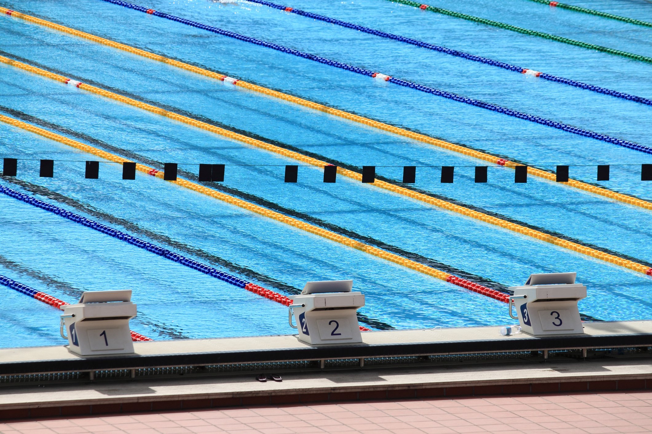 Three starting blocks at a swimming pool