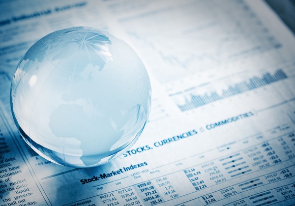 A magnifying glass over financial papers